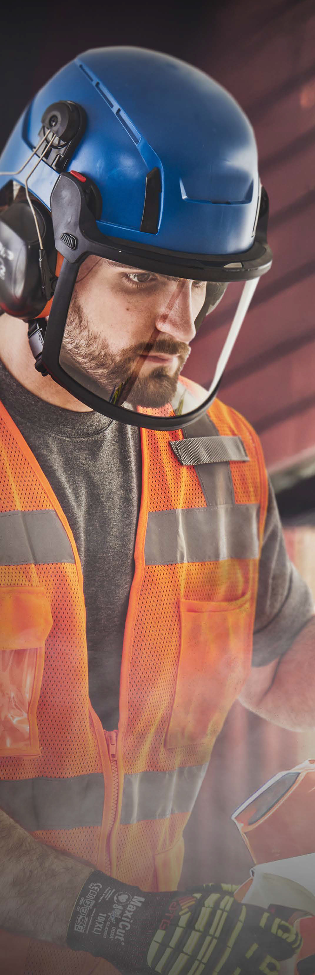 Man dressed in hi viz orange PPE wearing an RZRBack safety helmet